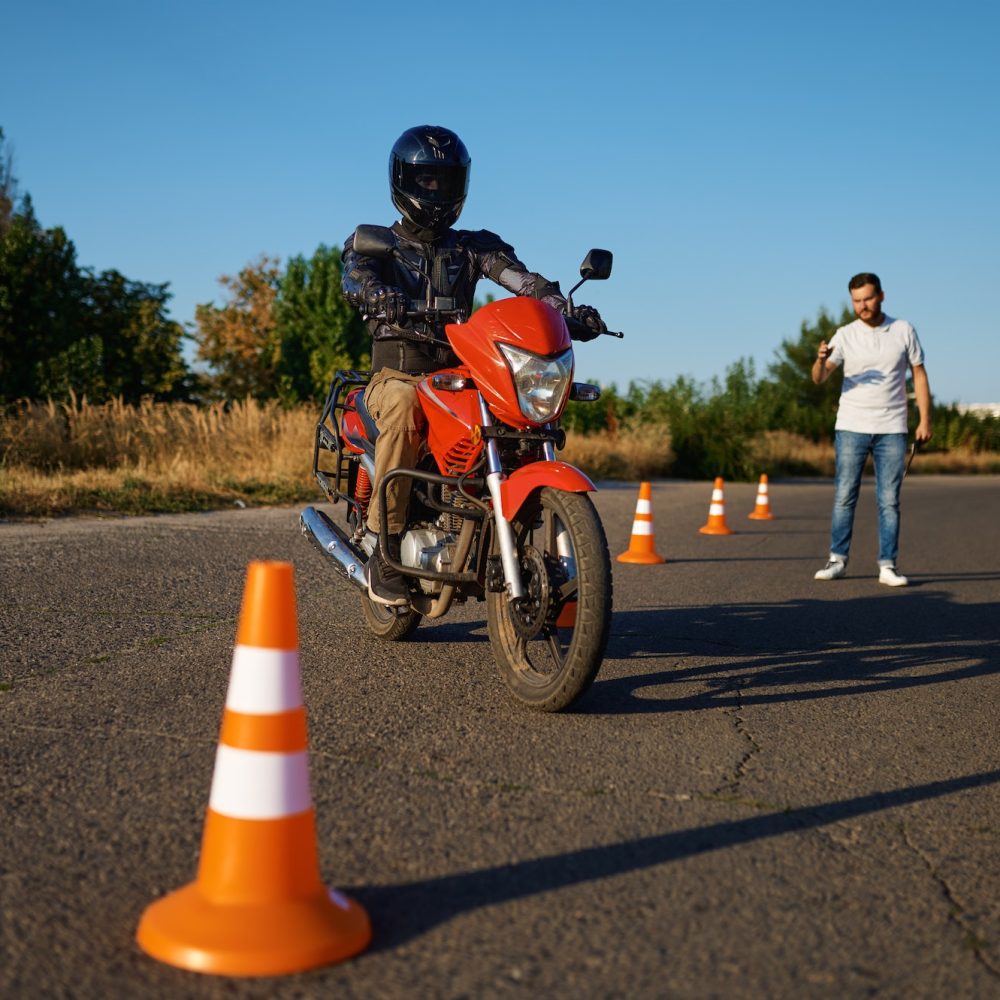Student and instructor, exam in motorcycle school
